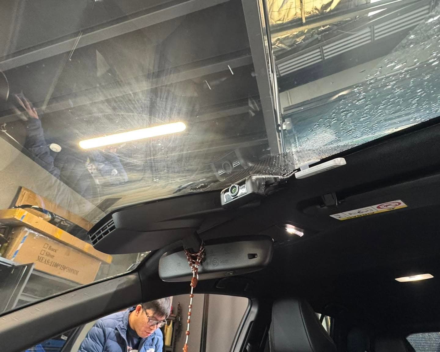 Front dash camera mounted discreetly behind a vehicle rear-view mirror in Melbourne